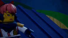 a lego girl with pink hair and headphones