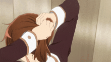 a person with a ring on their finger is covering their face with their hand