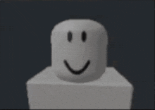 a cartoon character with a smiley face is sitting at a table .