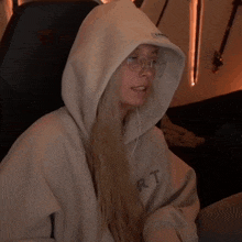 a woman wearing a hoodie with the word you on the front