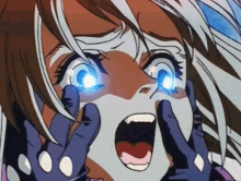 a close up of a girl 's face with her mouth open