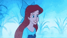 a cartoon of a little mermaid with a blue bow in her hair .