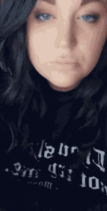 a woman is wearing a black shirt that says " i am a girl "
