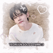 a boy in a white sweater with the words yeonjun solo d fame 3 on the bottom