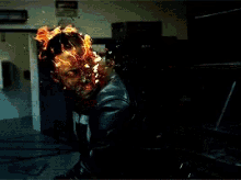 a picture of a ghost rider with flames coming out of his face