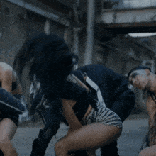a woman in zebra print shorts is kneeling down