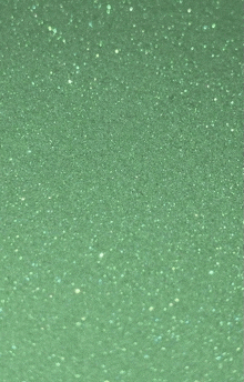 a close up of a green background with a lot of glitter