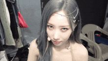 a woman with gray hair is wearing a headpiece