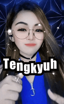 a woman wearing glasses and a choker has the word tengkyuh written on her face