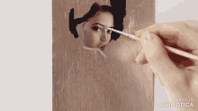 a person is painting a woman 's face with a brush made in animatica