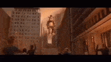 a teddy bear is flying through the air in a city while people watch .