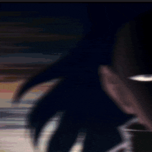 a close up of a man 's face with red eyes