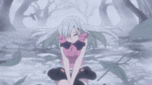 a girl with long white hair is kneeling down with her legs crossed