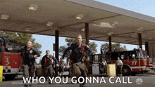 a group of firefighters running towards a fire truck with the words " who you gonna call " written on the bottom