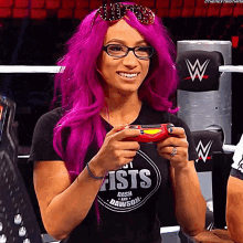 a woman wearing glasses and a shirt that says fist dash and dawson