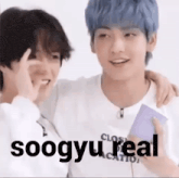 two boys with blue hair are standing next to each other and making funny faces .