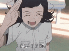 a girl in a school uniform is smiling and giving a high five .