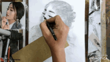 a person is drawing a woman 's face with a pencil and the words made in animotica are on the bottom