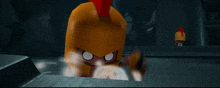 a cartoon character with a yellow helmet with a red crest