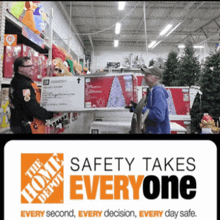 a man carrying a box in a store with a sign that says safety takes everyone