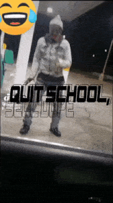 a man is standing in front of a sign that says quit school sell dope on it