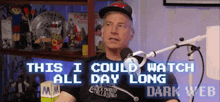 a man is sitting in front of a microphone with the words this i could watch all day long dark web