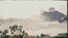 a painting is being painted on a canvas with the words made in animotica below it