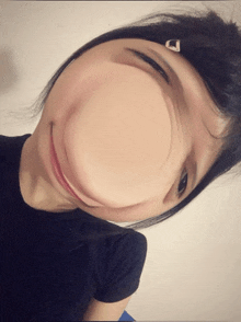 a woman making a funny face with the letter d on her hair