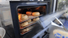 a bunch of potatoes are being cooked in an oven with the words made in animatica on the bottom