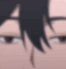 a close up of a person 's eyes with a blurry background