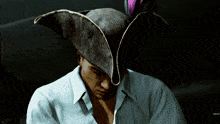 a man wearing a pirate hat with a feather on it