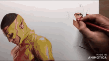 a drawing of a man in a yellow superhero costume is being made by animatica