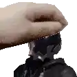 a pixelated image of a person 's head with a hand on top of it .