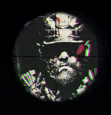 a sniper scope shows a man with a beard and a skull