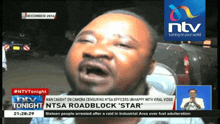 a man is being interviewed on ntv 's news channel