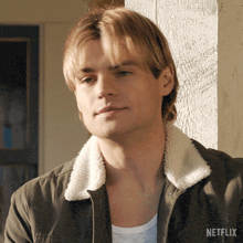 a close up of a man 's face with a netflix logo on the bottom