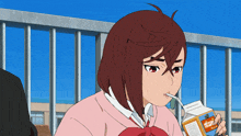 a girl is drinking from a carton that says tropicana on it