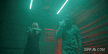 a gif from gifrun.com shows a man and woman