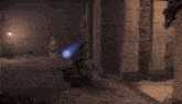 a person is walking in a dark room with a blue light coming out of a plant .