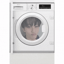 a white washer and dryer has a picture of a person in the door