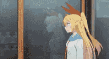 a girl with long blonde hair is standing in front of a window looking out .