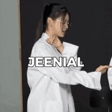 a woman in a lab coat with the word jeenial written above her