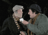 a man with a bandage on his face is talking to another man with a scarf around his neck
