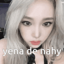 a close up of a woman 's face with the words yena de nahy written on her face .