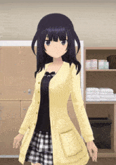 a girl in a yellow cardigan and plaid skirt