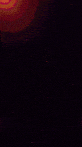 a computer generated image of a glowing circle with a purple center