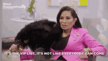 a woman wearing a tiara and a pink jacket says it 's the vip list