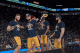 a group of basketball players holding a trophy that says ' champions ' on it
