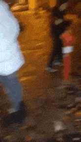 a blurry picture of a person walking down a street