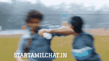 a blurry picture of two people with the words starttamilchat.in in the bottom right corner